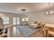 Open-concept living area with hardwood floors, modern lighting, and french doors leading to outdoor space at 2719 Hedgeway Cir, Kennesaw, GA 30144