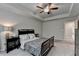 Well-lit main bedroom boasting tray ceiling and neutral tones creating a peaceful retreat at 2719 Hedgeway Cir, Kennesaw, GA 30144