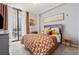 Bright bedroom boasts a comfortable bed, balcony access, and elegant decor at 3040 Peachtree Rd, Atlanta, GA 30305