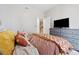 Comfortable bedroom with soft bedding, ample storage in the dresser, and serene ambiance at 3040 Peachtree Rd, Atlanta, GA 30305