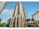 Stunning view of the high-rise building with attractive stone accents and private terraces overlooking the city at 3040 Peachtree Rd, Atlanta, GA 30305