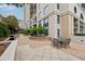 Landscaped courtyard with patio seating, barbecue grill, and lush greenery offering a tranquil outdoor space at 3040 Peachtree Rd, Atlanta, GA 30305