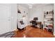 Cozy living space with hardwood floors, study space, and a decorative ceiling light fixture at 3040 Peachtree Rd, Atlanta, GA 30305