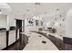 Elegant lobby featuring a reception desk, modern art, and a comfortable seating area with neutral tones and stylish decor at 3040 Peachtree Rd, Atlanta, GA 30305