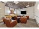 Cozy media room with comfortable seating, large screen TV, perfect for entertaining guests and enjoying movies at 3040 Peachtree Rd, Atlanta, GA 30305