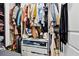 Organized walk-in closet with shelves, drawers, and hanging space for ample storage at 3040 Peachtree Rd, Atlanta, GA 30305