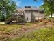 Home featuring a wooden deck, with a spacious backyard and green landscaping at 643 Windy Mill Way, Temple, GA 30179