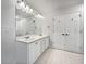 Clean bathroom featuring double sinks, modern fixtures, and white cabinets at 643 Windy Mill Way, Temple, GA 30179