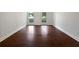 Bedroom featuring hardwood floors, large windows, and neutral-colored walls at 643 Windy Mill Way, Temple, GA 30179