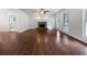 Expansive living room with fireplace, ceiling fan and hardwood flooring at 643 Windy Mill Way, Temple, GA 30179