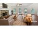 Bright living room with a stone fireplace, hardwood floors, and lots of natural light at 643 Windy Mill Way, Temple, GA 30179