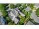 Detailed aerial view showcases the home's sprawling layout, lush landscaping, and a private driveway at 6930 Wesley Hughes Rd, Cumming, GA 30040