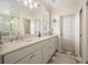 Bathroom featuring a marble countertop and modern fixtures at 6930 Wesley Hughes Rd, Cumming, GA 30040