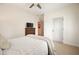 Cozy bedroom features a bed, dresser, closet and a mounted television at 6930 Wesley Hughes Rd, Cumming, GA 30040