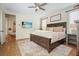 Spacious bedroom with a ceiling fan and an elegant rug at 6930 Wesley Hughes Rd, Cumming, GA 30040