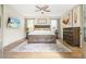 Bedroom with a decorative rug and a mounted TV at 6930 Wesley Hughes Rd, Cumming, GA 30040
