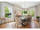 Elegant dining room with ample seating, natural light, and stylish decor for memorable gatherings at 6930 Wesley Hughes Rd, Cumming, GA 30040
