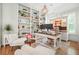 Cozy home office with built-in shelving and a desk with a hutch at 6930 Wesley Hughes Rd, Cumming, GA 30040