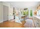 Bright and airy kitchen with white cabinets, stainless steel appliances, and a central island at 6930 Wesley Hughes Rd, Cumming, GA 30040