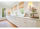 Beautiful kitchen boasts ample counter space, perfect for meal prep and casual dining at 6930 Wesley Hughes Rd, Cumming, GA 30040