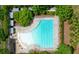 Aerial view of a community swimming pool with lounge chairs and mature landscaping at 6930 Wesley Hughes Rd, Cumming, GA 30040