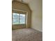 Bedroom featuring carpeted flooring and a large window at 7703 Hansel Ln, Lithonia, GA 30058