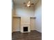 Bright living room with high ceilings, a fireplace, and dark wood floors at 7703 Hansel Ln, Lithonia, GA 30058