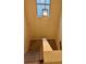 Carpeted staircase with wooden railings and a modern light fixture at 7703 Hansel Ln, Lithonia, GA 30058