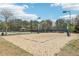 A sand volleyball court on a sunny day at 3887 Hickory Manor Dr, Suwanee, GA 30024