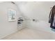 This walk-in closet has carpet floors, a window, and white wire shelving at 3887 Hickory Manor Dr, Suwanee, GA 30024