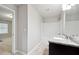 A well-lit bathroom including a tub and shower combination and granite vanity at 5590 Bright Cross Way, Suwanee, GA 30024