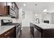 Beautiful kitchen with granite countertops, stainless steel appliances, and hardwood floors at 5590 Bright Cross Way, Suwanee, GA 30024