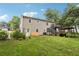 The property's backyard showcases a home with a deck, a patio cover, and lush landscaping at 73 Azalea Dr, Villa Rica, GA 30180