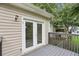 A home's backyard deck features direct access via sliding glass doors at 73 Azalea Dr, Villa Rica, GA 30180