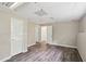 Spacious basement area with multiple doors and updated gray wood-look flooring at 73 Azalea Dr, Villa Rica, GA 30180