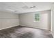 Basement area with painted walls, updated flooring, and bright window at 73 Azalea Dr, Villa Rica, GA 30180