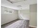 Spacious basement with gray walls, window, and modern gray wood-look flooring at 73 Azalea Dr, Villa Rica, GA 30180