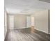 Open basement space with hard surface floors, painted walls and three doors at 73 Azalea Dr, Villa Rica, GA 30180