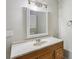 Bathroom features a marble countertop and an ornate mirror above the wood vanity at 73 Azalea Dr, Villa Rica, GA 30180