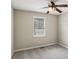 Bedroom features neutral carpet and a bright window at 73 Azalea Dr, Villa Rica, GA 30180