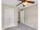 Bedroom with carpeted floor, ceiling fan, and closet at 73 Azalea Dr, Villa Rica, GA 30180