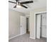 Bedroom features neutral carpet, ceiling fan, and closet at 73 Azalea Dr, Villa Rica, GA 30180