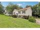 Charming split-level home featuring a well-manicured lawn, traditional siding, and decorative shutters at 73 Azalea Dr, Villa Rica, GA 30180