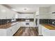Bright kitchen features white cabinets, stainless steel appliances, and dark backsplash at 73 Azalea Dr, Villa Rica, GA 30180