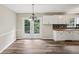 Eat in kitchen area with modern lighting, cabinetry, and easy access to an outdoor deck at 73 Azalea Dr, Villa Rica, GA 30180