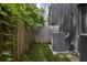 A small fenced backyard features easy maintenance artificial grass alongside modern home at 133 City View Ne Ct, Atlanta, GA 30308
