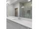 Bathroom with a double sink vanity and a glass shower creates a sleek and functional space for everyday use at 133 City View Ne Ct, Atlanta, GA 30308