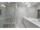 Modern bathroom featuring a glass-enclosed shower, double sink vanity, and elegant tile work for a spa-like experience at 133 City View Ne Ct, Atlanta, GA 30308