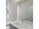 Modern bathroom featuring sleek fixtures, a large mirror, and a shower-tub combo for a luxurious experience at 133 City View Ne Ct, Atlanta, GA 30308