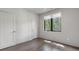 This well-lit bedroom features wood floors, a large window, and ample space, creating a serene atmosphere at 133 City View Ne Ct, Atlanta, GA 30308